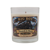 Candle with a decorative label featuring a Big Boy 4014 design on a white background. Scent is floral, fresh, earthy