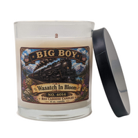 Candle with a label featuring 'Big Boy' and 'Wasatch in Bloom' on a white background.  Floral, fresh, earthy