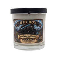 Candle with a label featuring Big Boy design. Earthy, fruity, floral, fresh. Shown with lid.