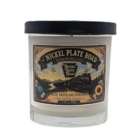 Candle in a glass jar and lid with a vintage label featuring 'Nickel Plate Road' steam locomotive 757 or 765, Blue Skies and Sunshine, scent is fresh, fruity, floral, earthy